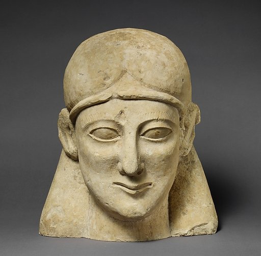 Limestone head of a beardless male with a fillet