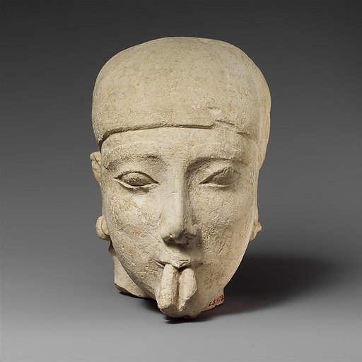 Limestone head of a male aulos player