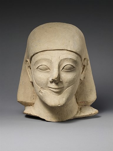 Limestone head of a bearded male with a plain headdress
