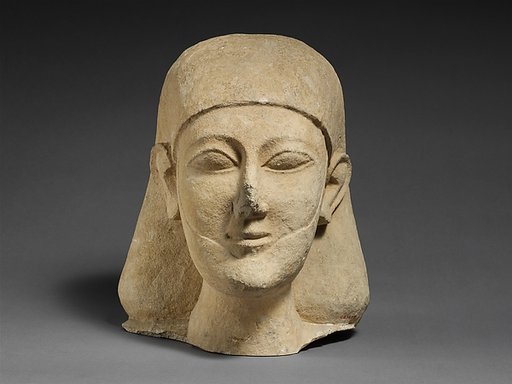 Limestone head of a bearded male with a plain headdress