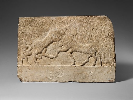 Limestone votive relief with a lion killing a bull and two human figures