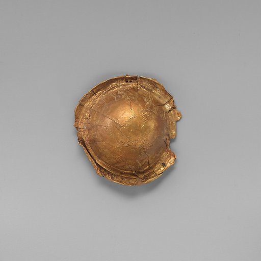 Gold roundel of bulbous form