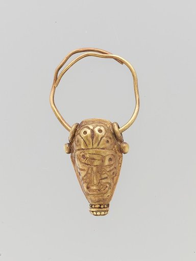 Gold earring in the form of a bull's head