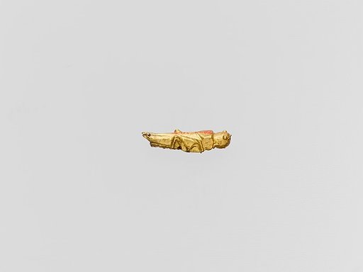 Gold capsule in the form of a grasshopper