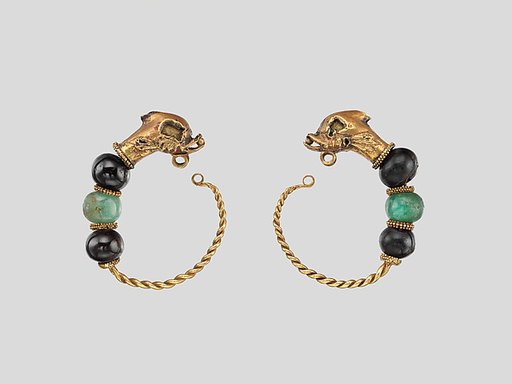 Gold, beryl, and garnet earring with head of a doplhin