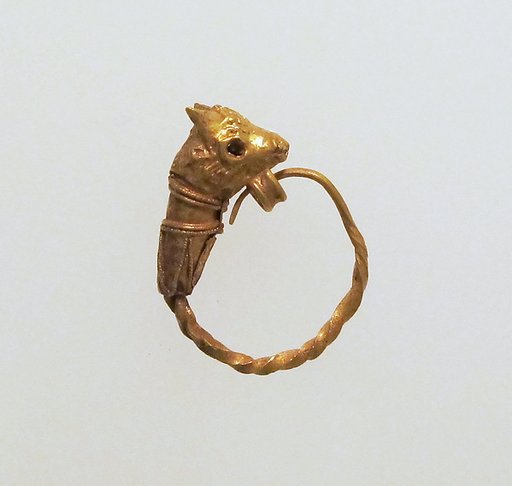 Gold earring with head of a bull
