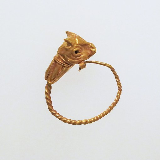 Gold earring with head of a bull