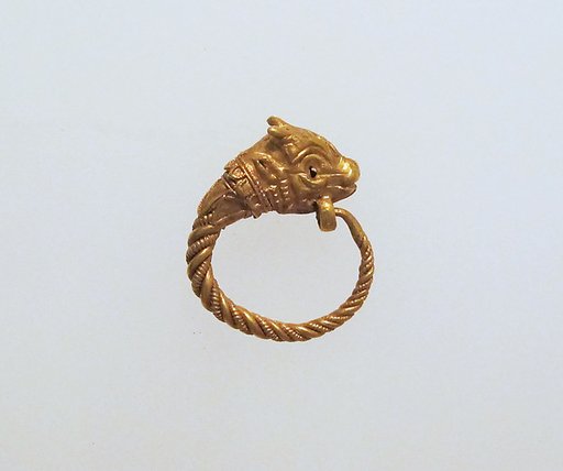 Gold earring with head of a bull