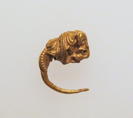Gold earring with head of a bull