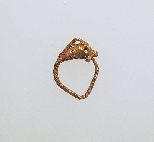 Gold earring with head of a goat