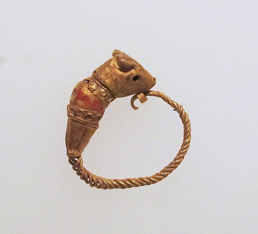 Gold earring with head of a bull