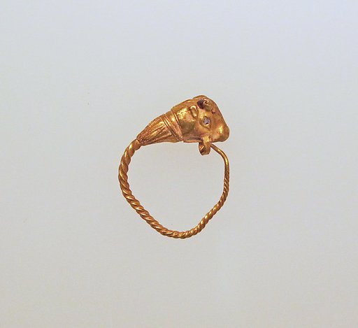 Gold earring with head of a bull