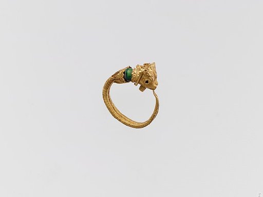Gold earring with two bulls' heads and glass bead