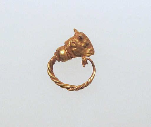 Gold earring with head of a bull