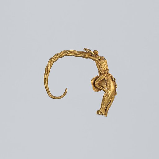 Gold earring with winged figure (one of a pair)