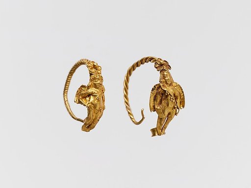 Gold earring with winged figure