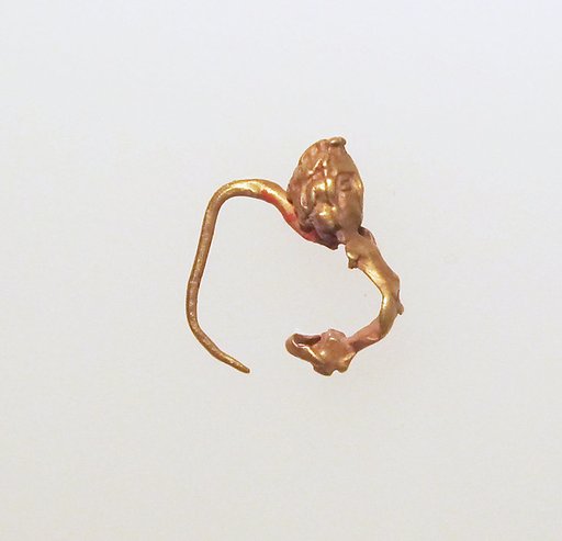 Gold earring with figure