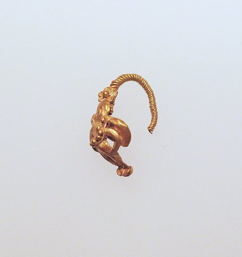 Gold earring with winged figure