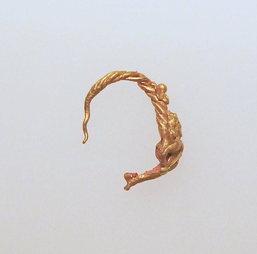 Gold earring with figure