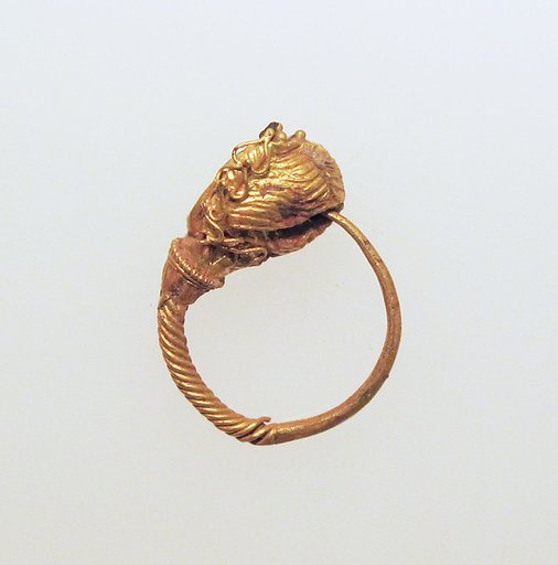 Gold earring with woman's head