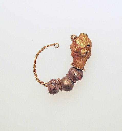 Gold earring with woman's head and glass beads