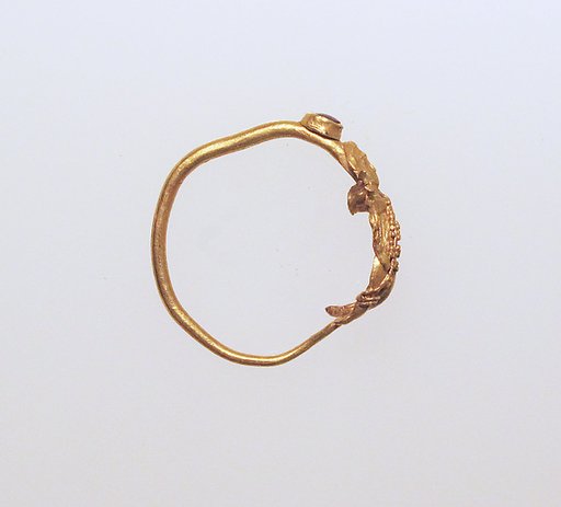 Earring with human figure