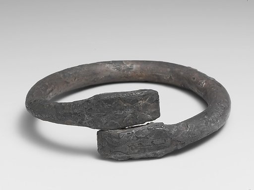 Silver bracelet ending in snake's heads