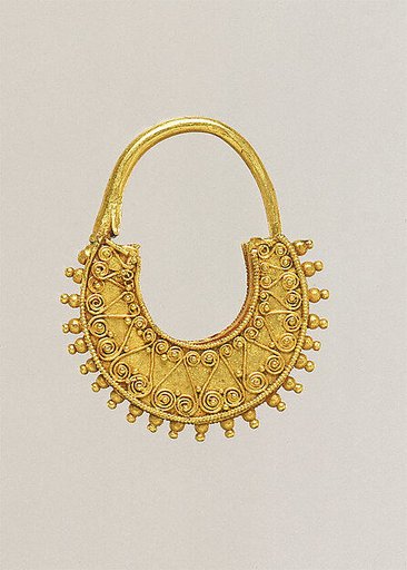 Gold crescent-shaped earring