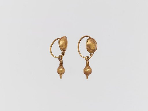 Pair of gold earrings with disc and pendant