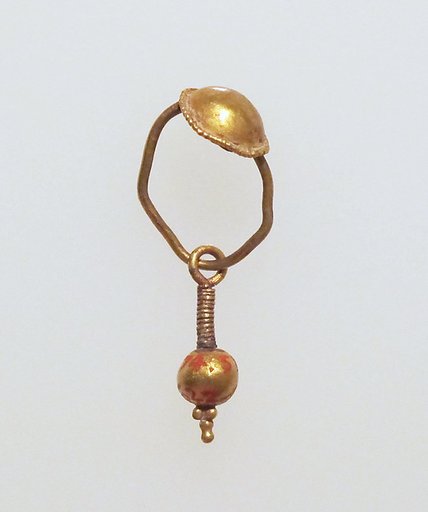 Gold earring with disc and pendant