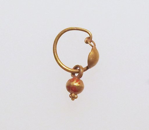 Gold earring with disc and pendant