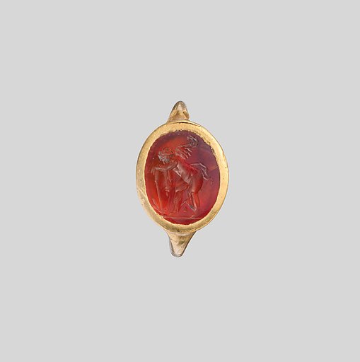 Gold ring with carnelian intaglio: Eros with flaming torch