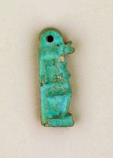 Faience amulet of Isis suckling the infant Horus