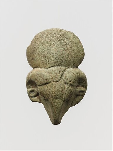 Faience amulet of a ram's head with sun disk crown