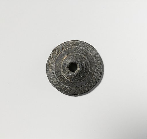 Schist spindle whorl
