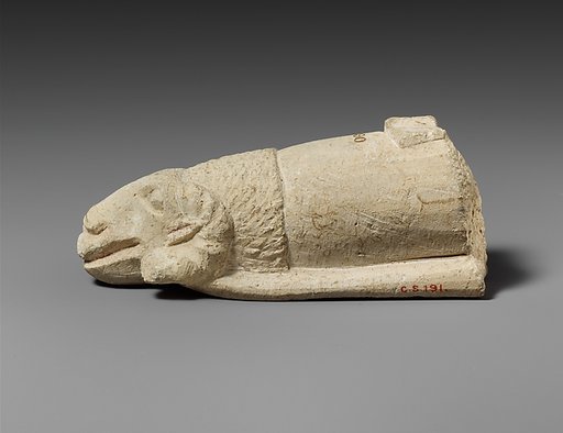 Limestone handle of a patera or a fire shovel ending in a ram’s head