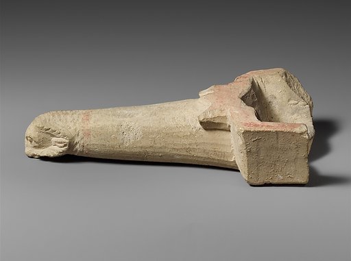 Limestone handle of a patera or a fire shovel ending in a ram’s head