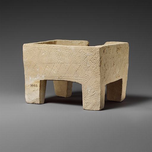 Limestone chest with incised decoration