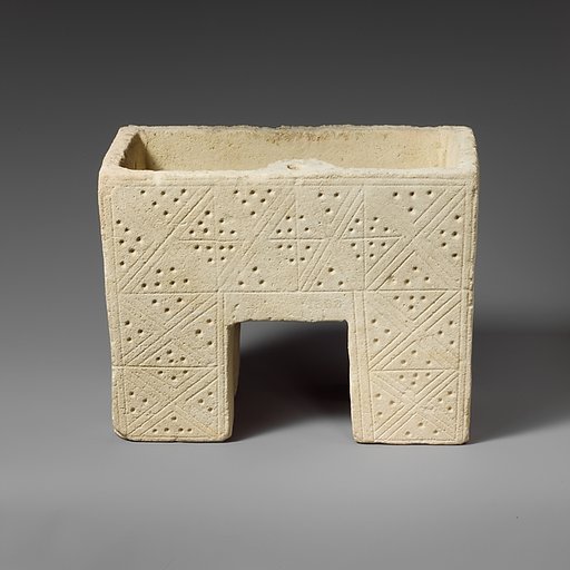 Limestone chest with incised decoration