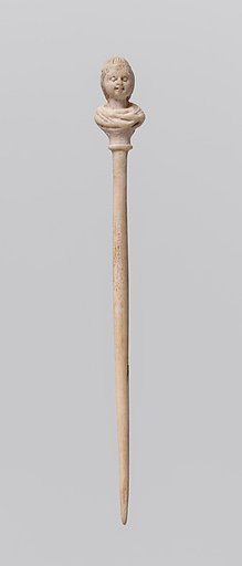 Bone hairpin with female head