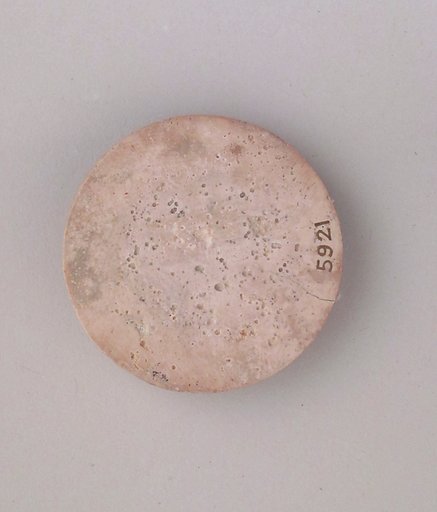 Ivory disk of a pyxis with rosette