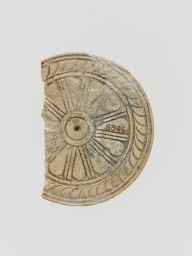 Ivory disk of a pyxis with rosette