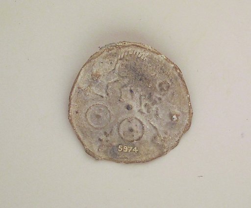 Lead votive roundel with table offerings