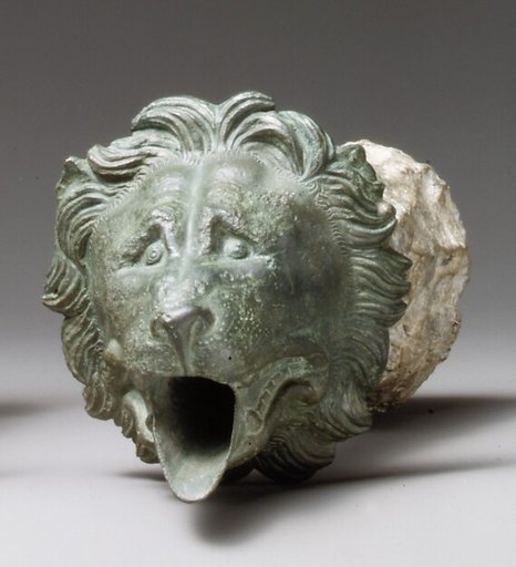 Bronze water spout with lion mask (one of a pair)