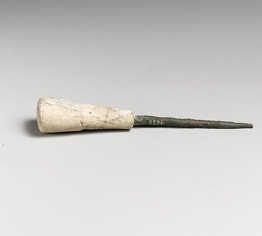 Ivory and bronze awl
