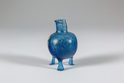 Glass bottle with three feet