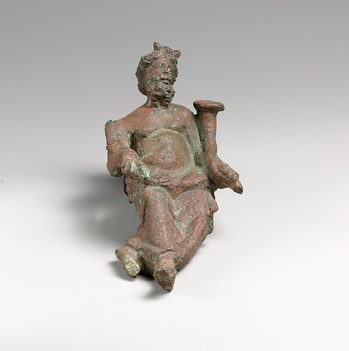 Bronze statuette of a god holding a cornucopia