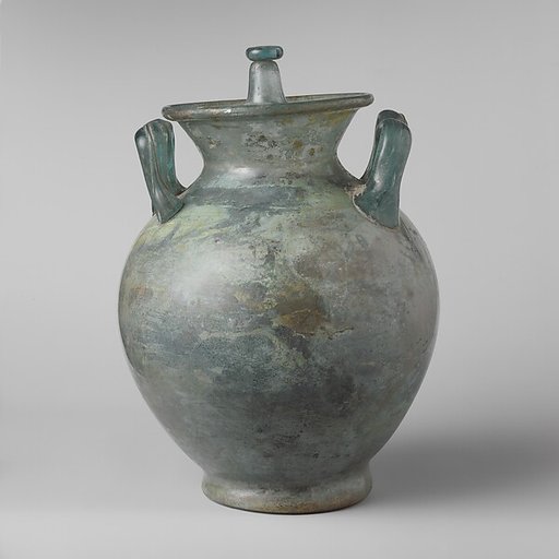 Glass cinerary urn with lid