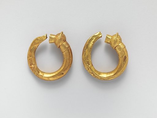 Gold trumpet-shaped earrings