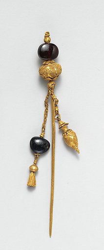 Gold and garnet pin